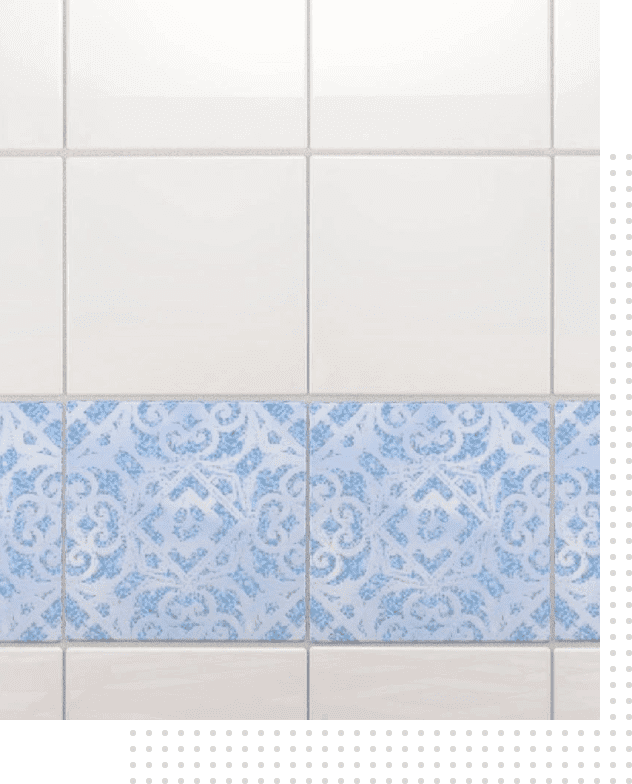 A tile wall with blue and white designs.