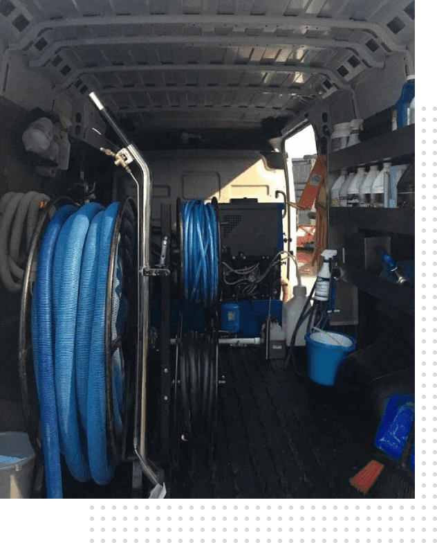 A van with many blue hoses in it