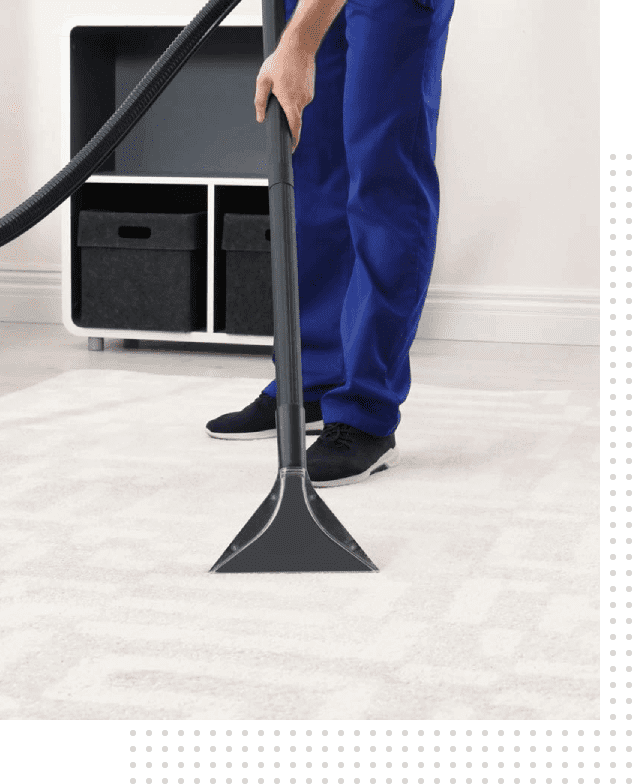 A person is vacuuming the floor of their home.